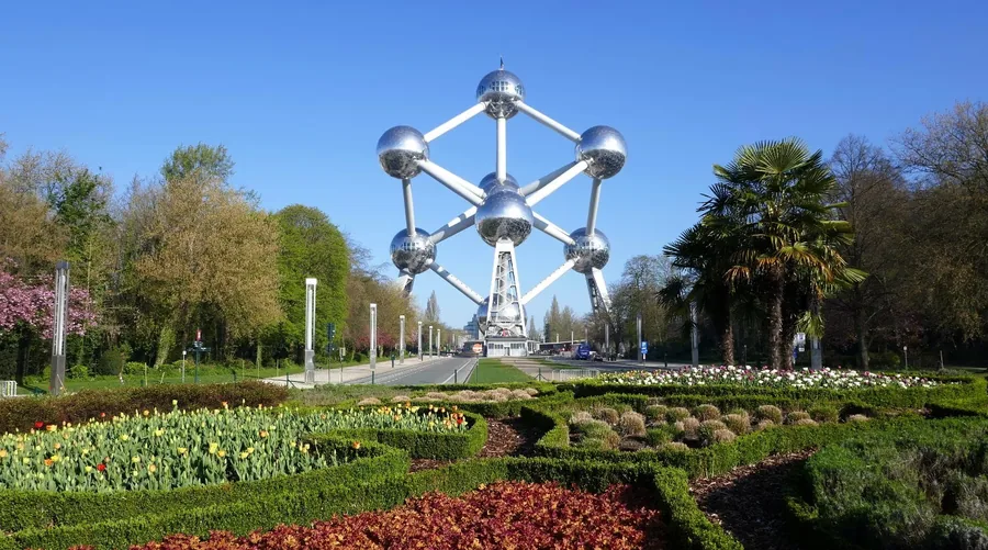 The Atomium above a garden on a sunny day.