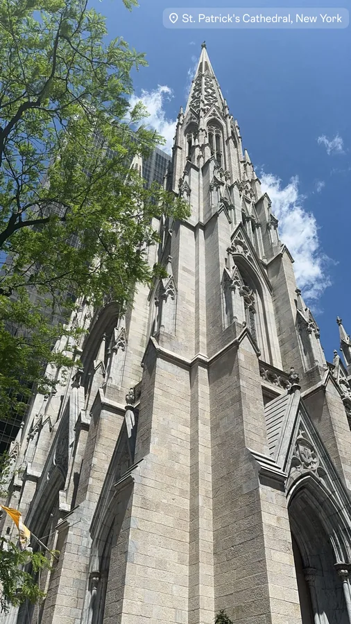 St. Patrick’s Cathedral rising against a blue sky in New York.