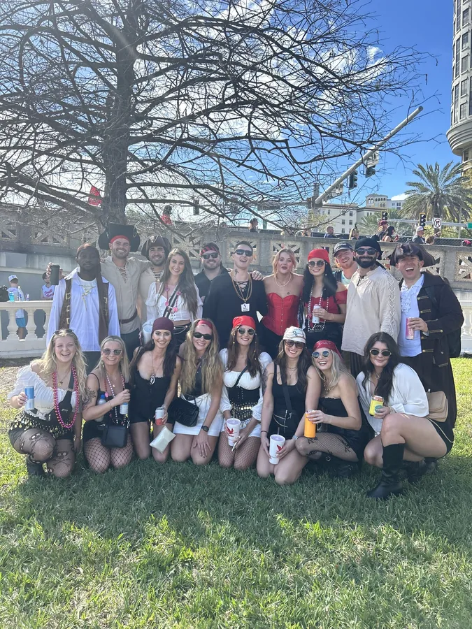 A group posing together in a garden.